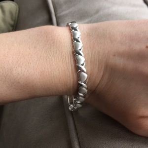 Interlocking heart tennis bracelet